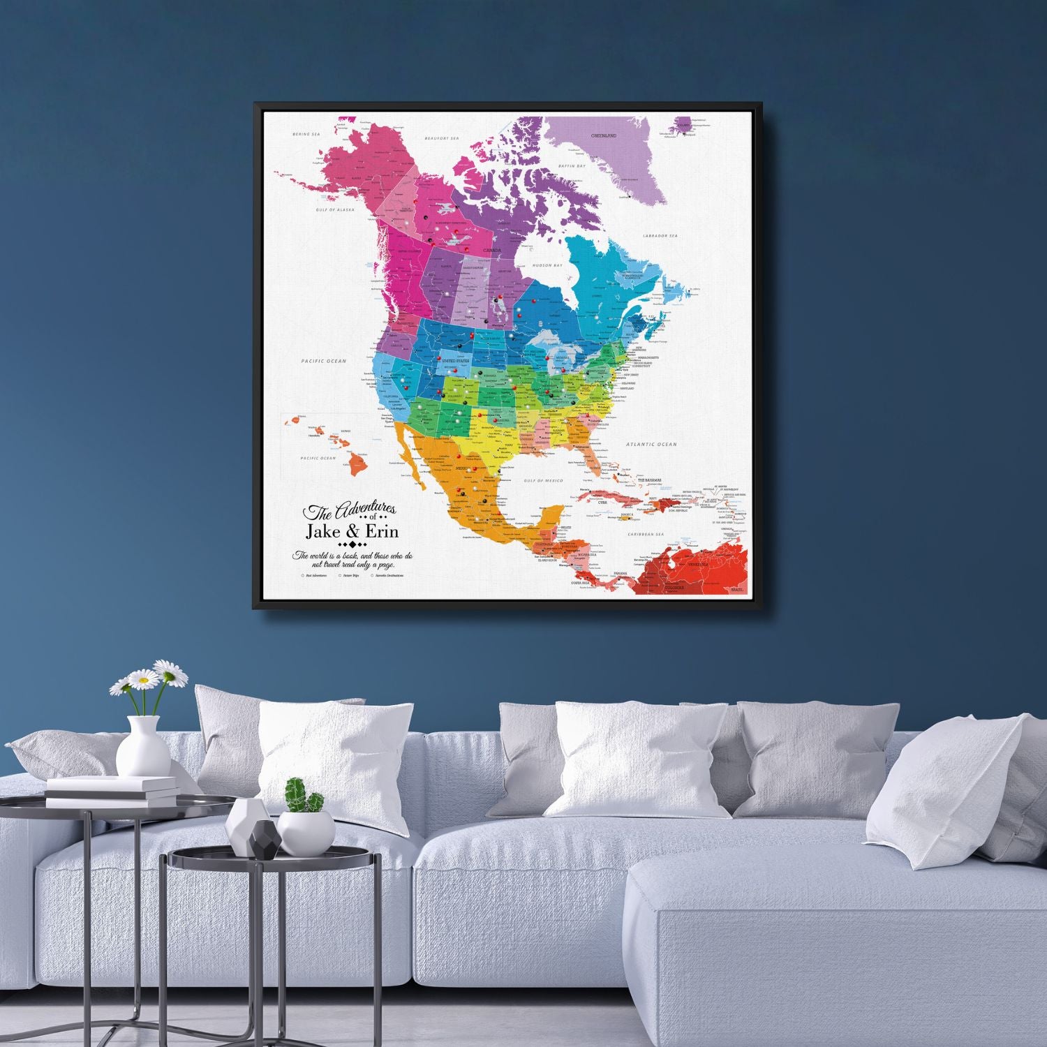 Colorful North America travel map canvas with pins displayed above modern white sofa