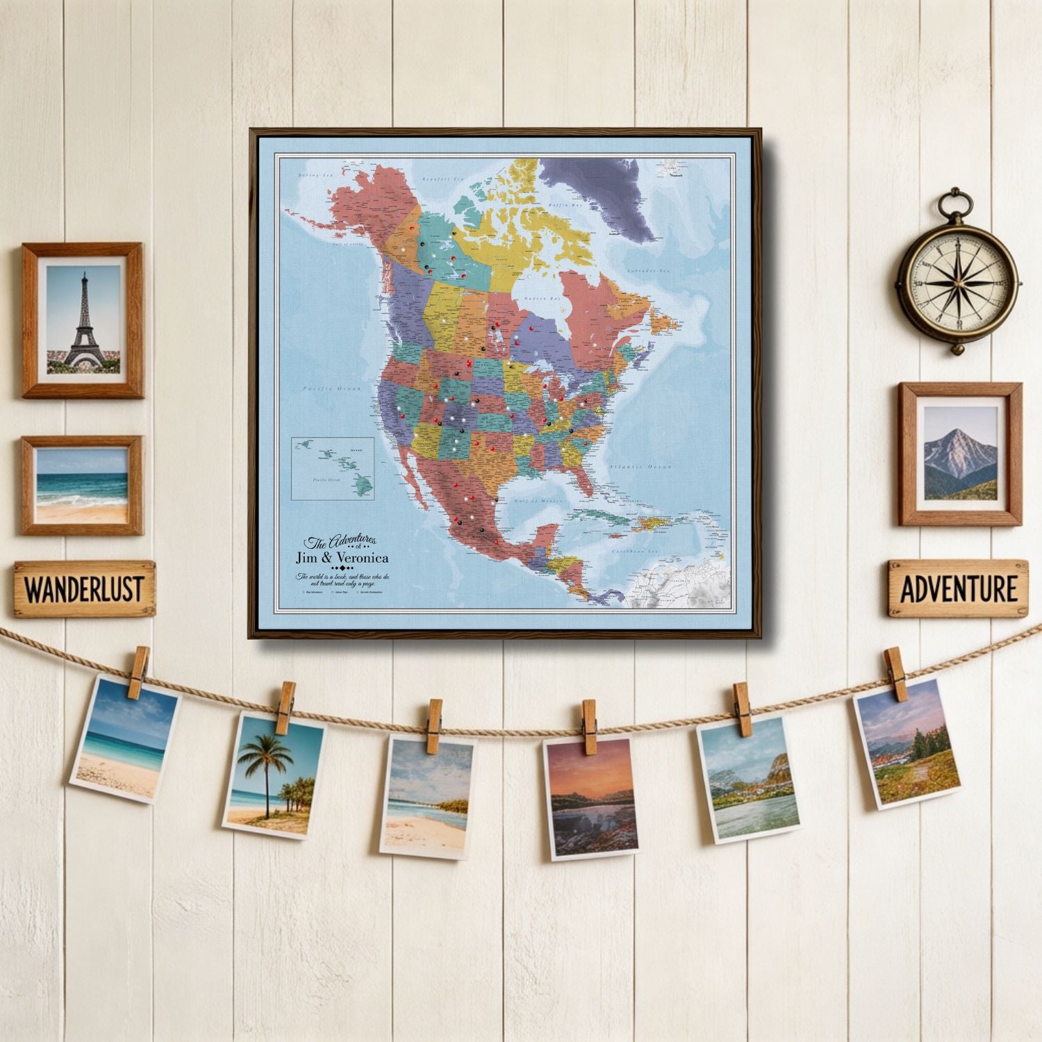Personalized Blue Oceans North America travel map with pins in dark wood frame displayed on white shiplap wall with travel photos and wanderlust decor