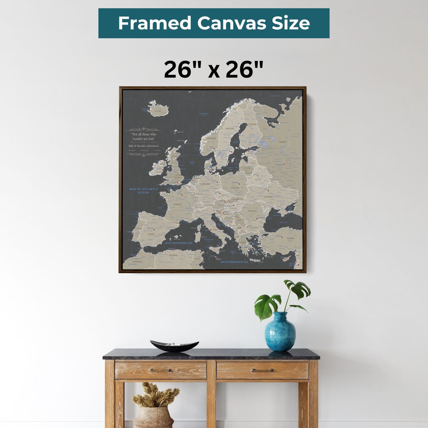 26x26 inch earth toned Europe travel map framed canvas with pins displayed above wooden console table