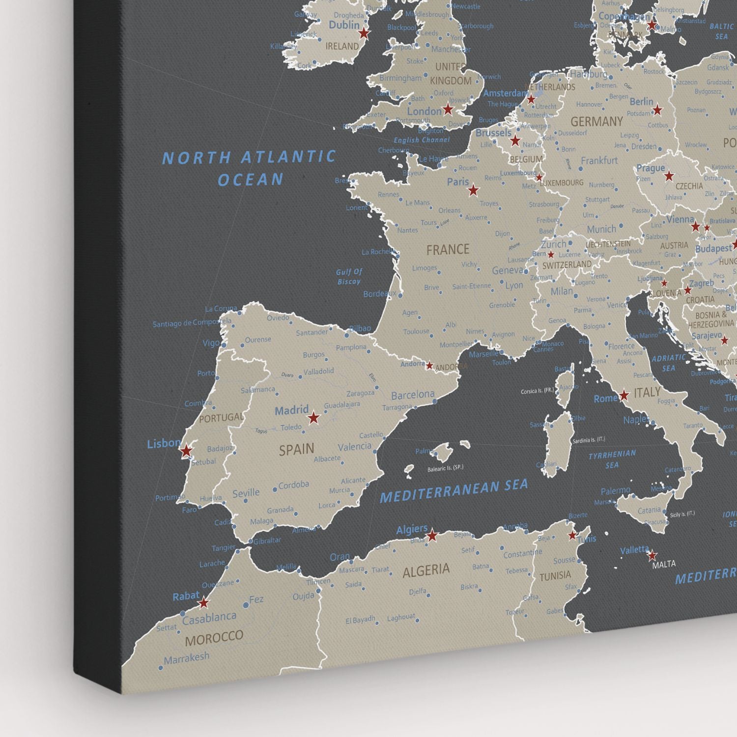 Earth toned Europe travel map canvas with red star pins on dark gray background