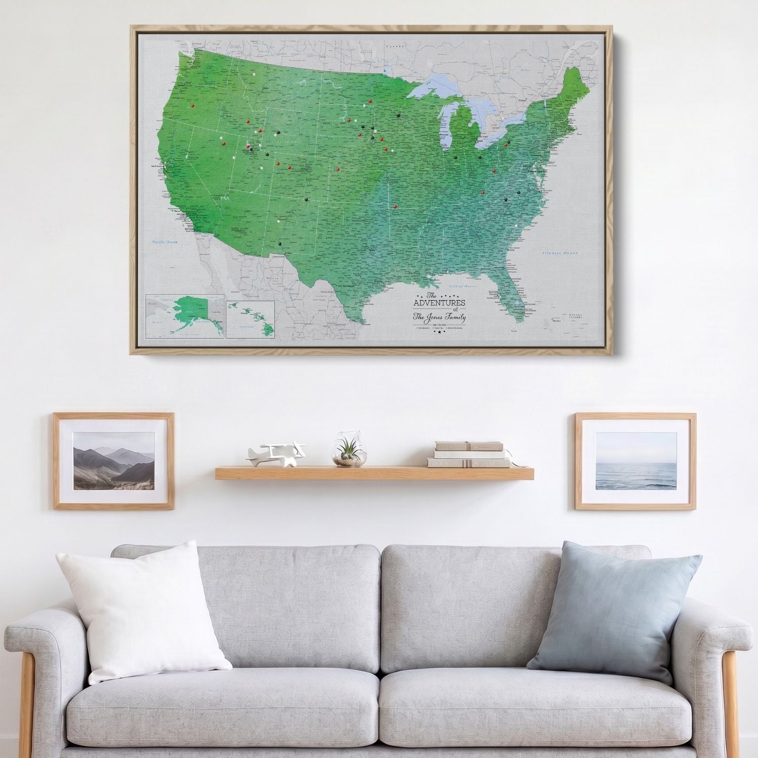 Enchanting Emerald watercolor USA travel map canvas with red and black pins displayed above living room sofa