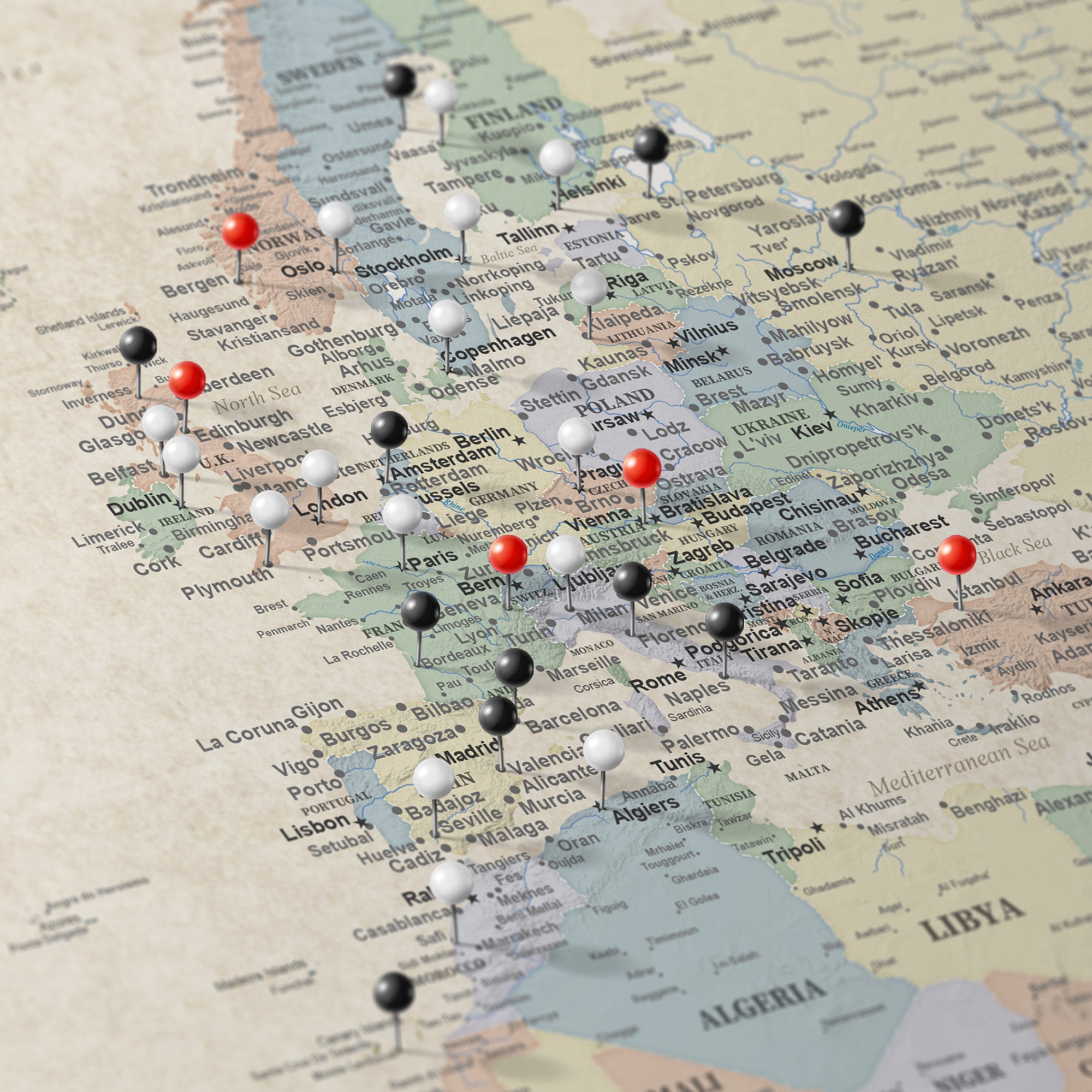 Sandy Dreams Europe travel map canvas with red black and white push pins marking visited cities