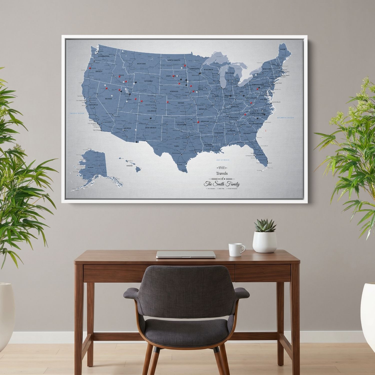 Personalized Blue Ice USA push pin travel map canvas hanging above home office desk with red and black pins marking visited states