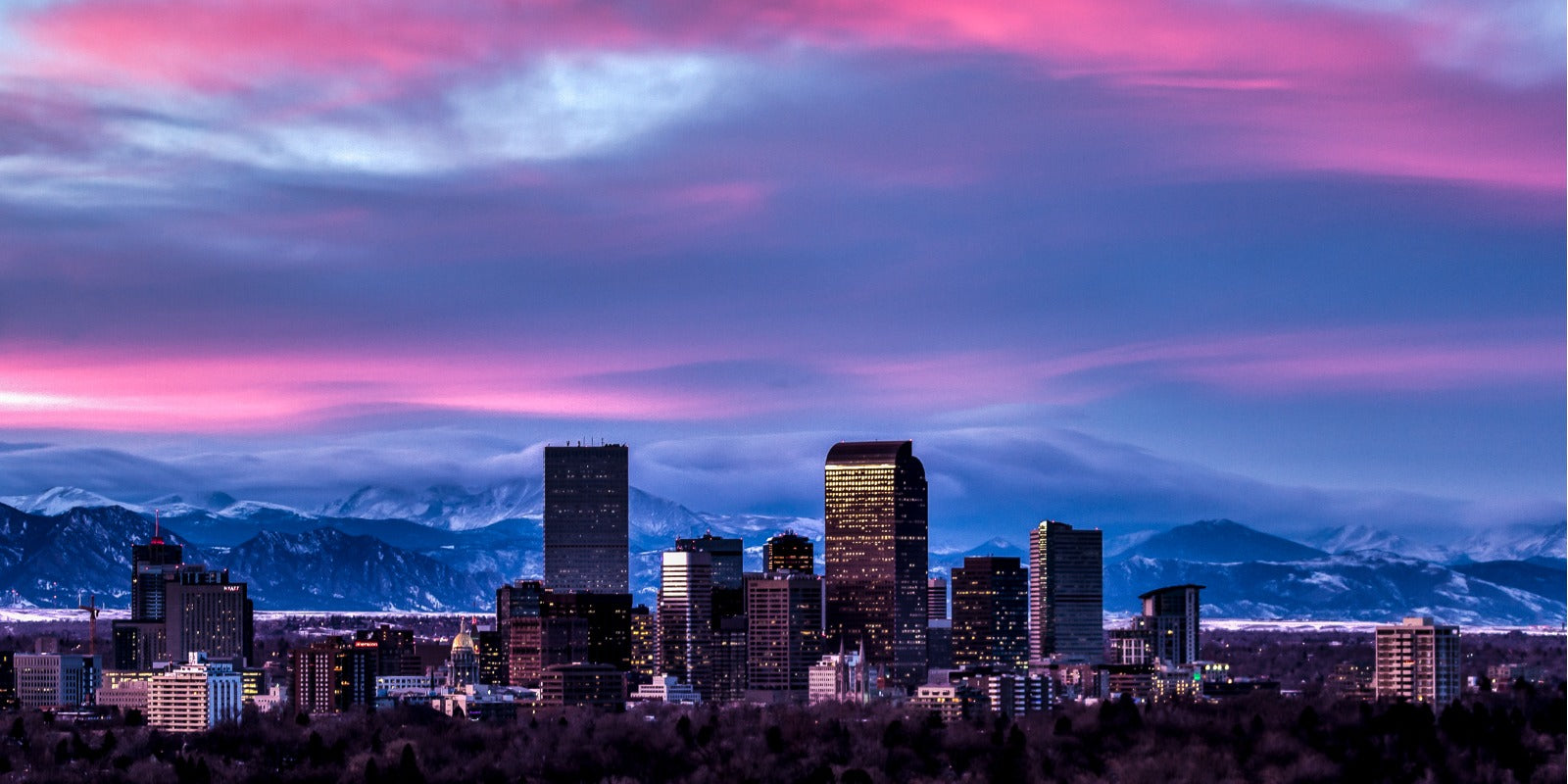 Denver, CO City Skyline with Snowy Mountain Peaks