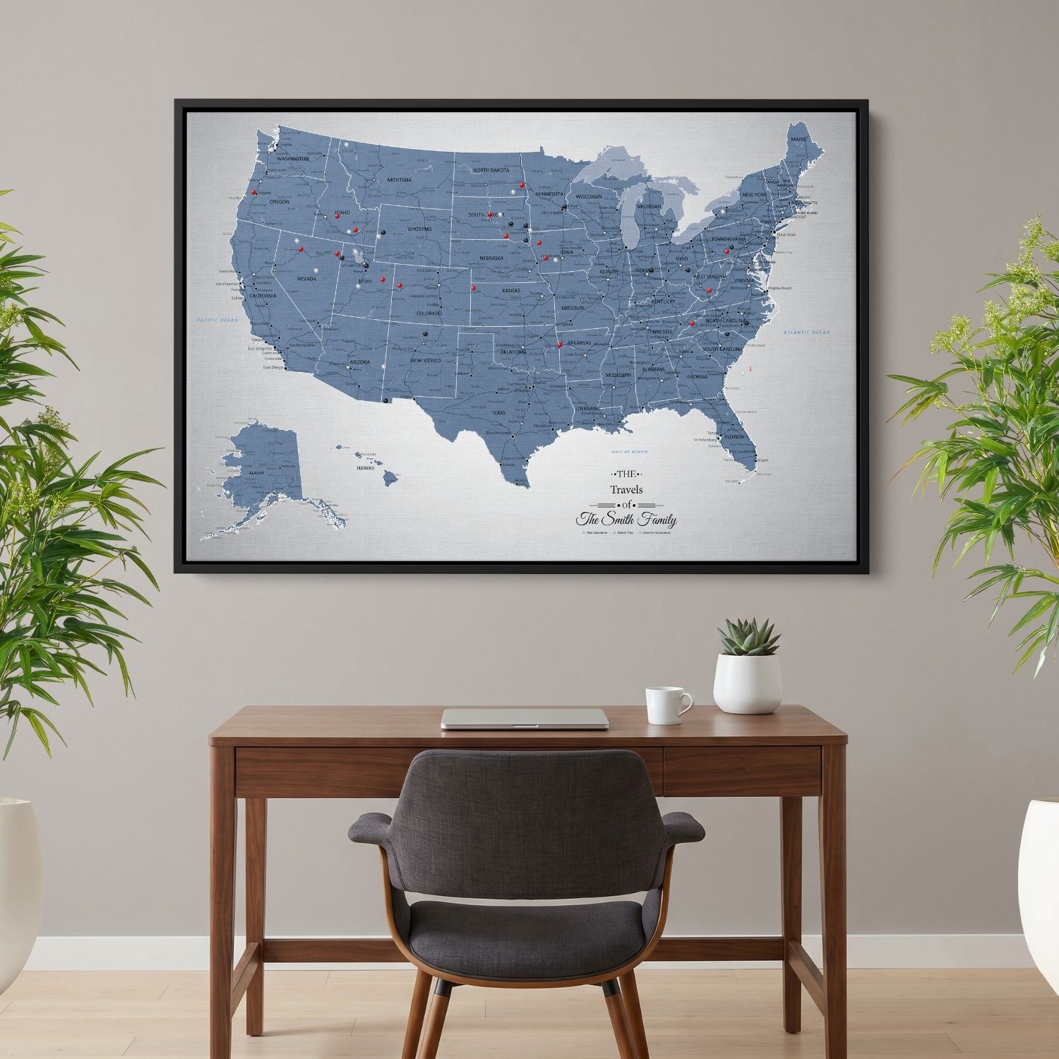 Blue Ice USA push pin travel map canvas hanging above wooden desk in home office setting