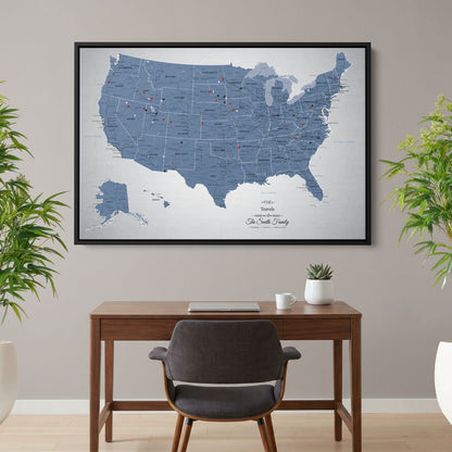 Blue Ice USA push pin travel map canvas hanging above wooden desk in home office setting