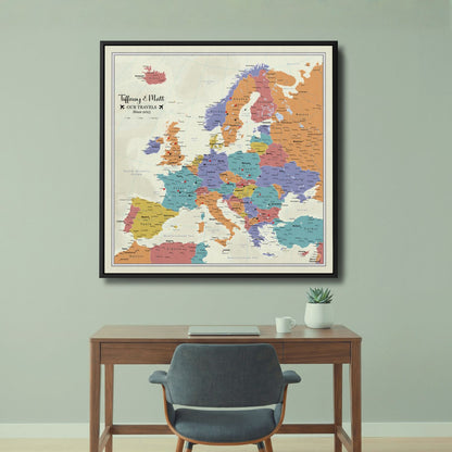 Personalized tan ocean Europe push pin travel map on canvas in black frame above desk