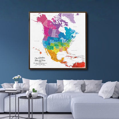 Colorful North America travel map canvas with pins displayed above modern white sofa