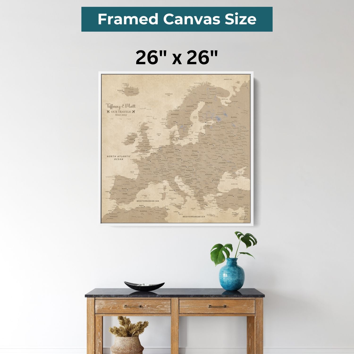 26x26 inch framed canvas vintage Europe travel map with pins displayed above wooden console table