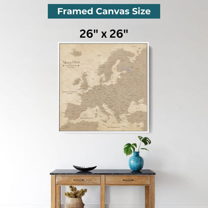 26x26 inch framed canvas vintage Europe travel map with pins displayed above wooden console table