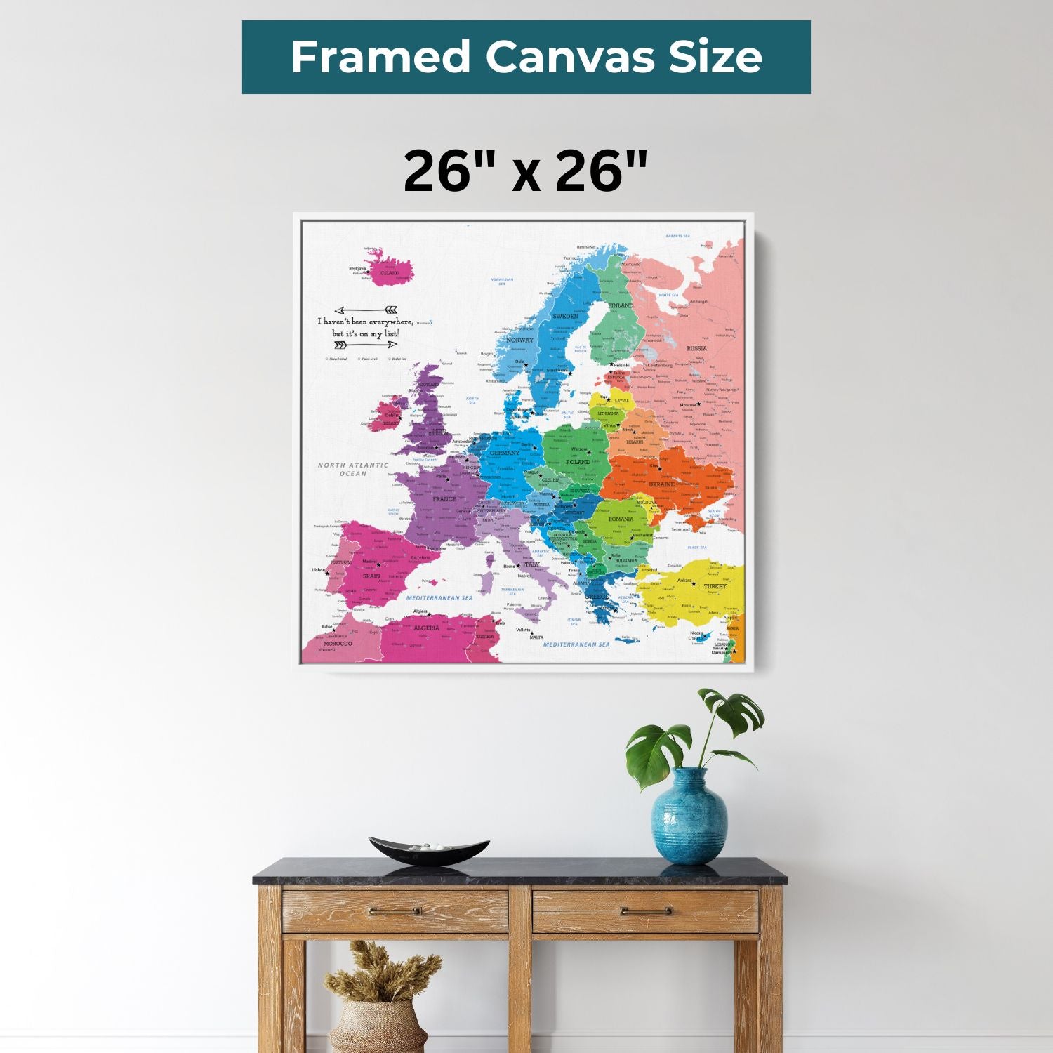 26x26 inch framed canvas colorful Europe travel map with pins hanging above wooden console table