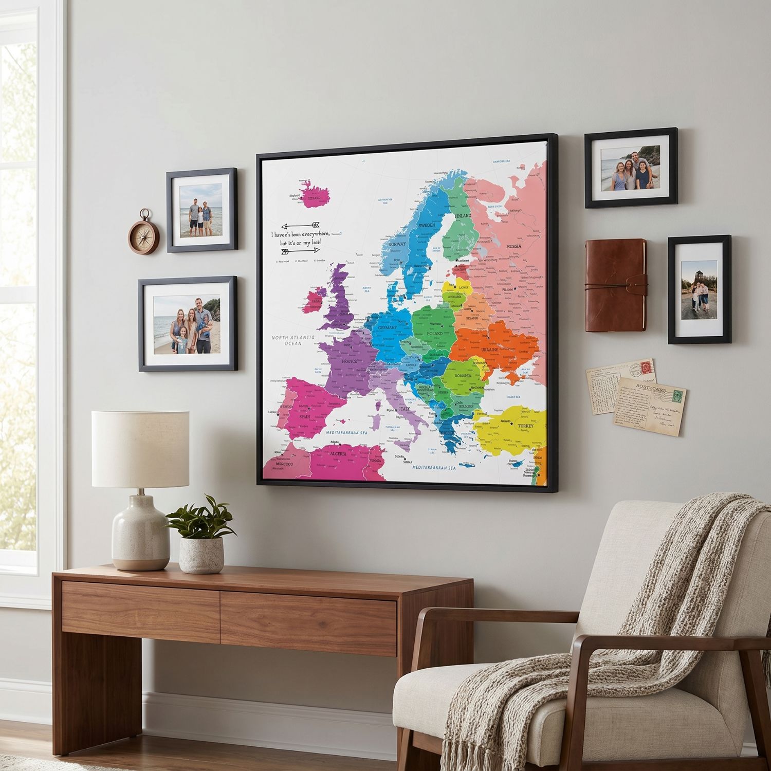 Colorful Europe travel map canvas with black frame displayed in modern living room wall decor