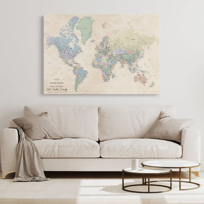 Personalized Gallery Wrapped Sandy Dreams world travel map stretched canvas with red and black pins displayed above neutral sofa in living room