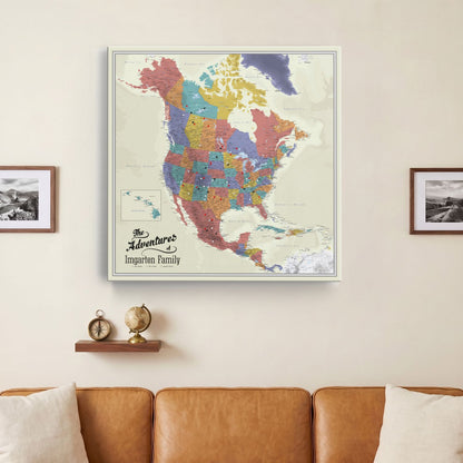 Personalized North America push pin travel map canvas hung above leather sofa in living room