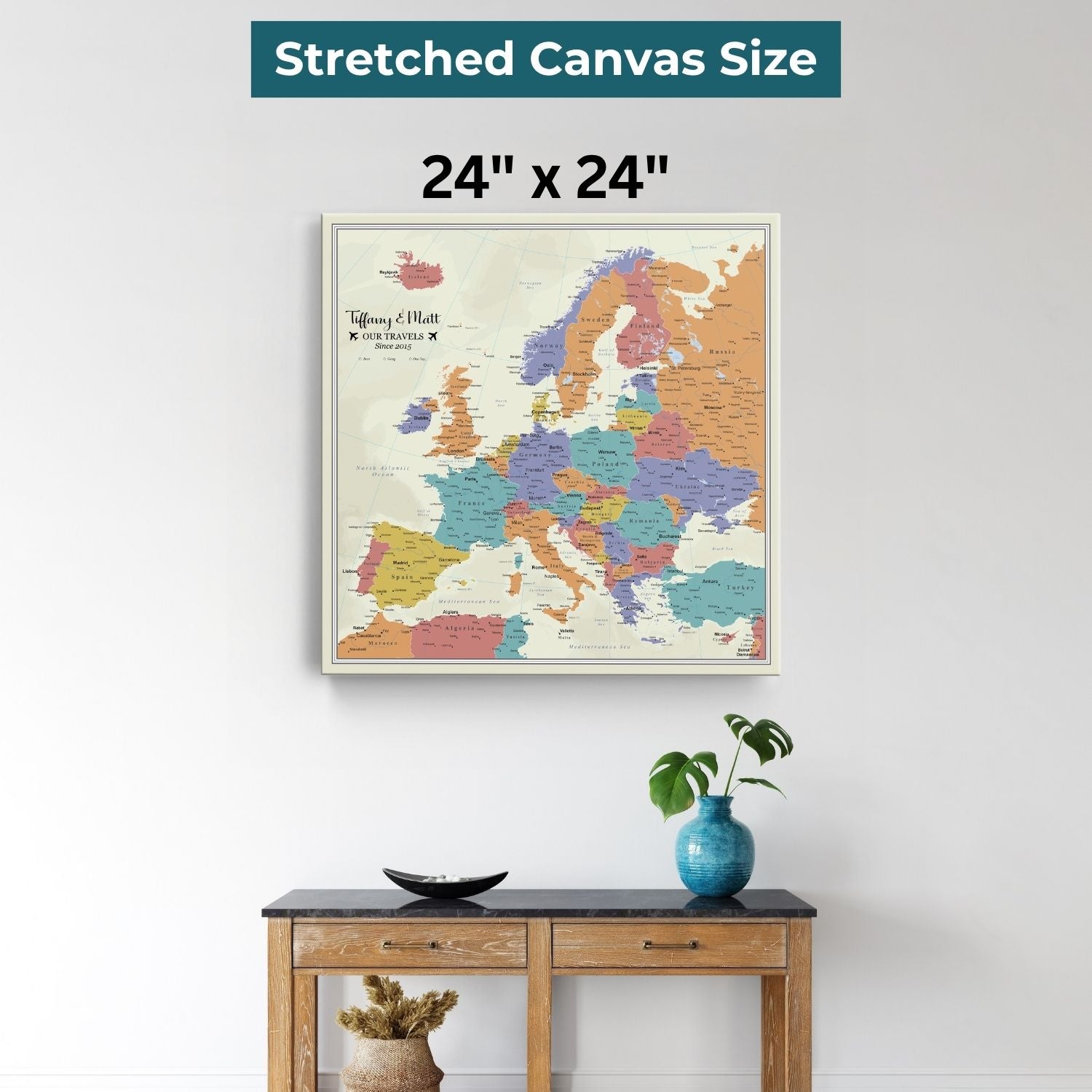 24x24 inch gallery wrapped Europe travel map canvas with tan oceans displayed above wooden console table