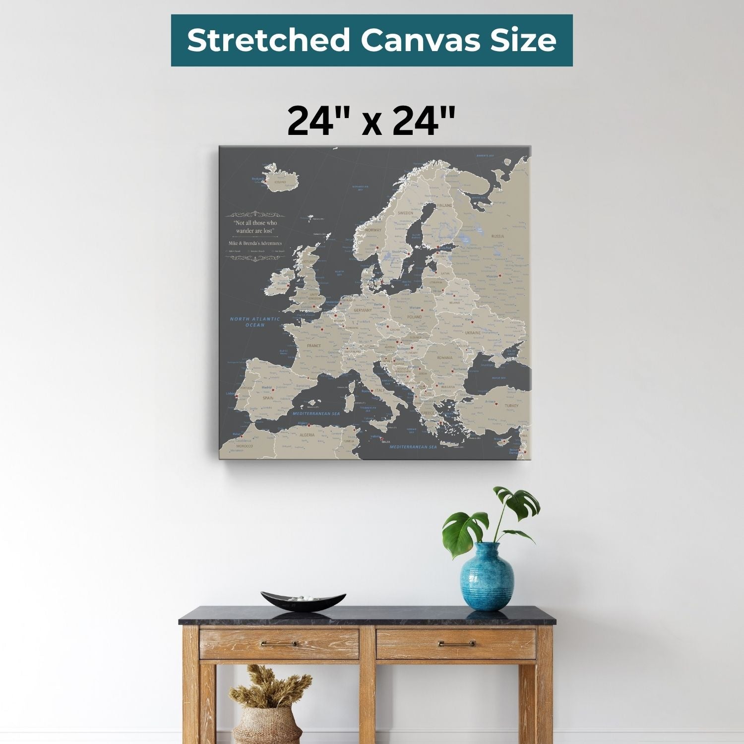 24x24 inch earth toned Europe travel map canvas displayed above wooden console table with blue vase
