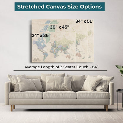 Sandy Dreams world travel map canvas displayed in three sizes above modern beige living room sofa