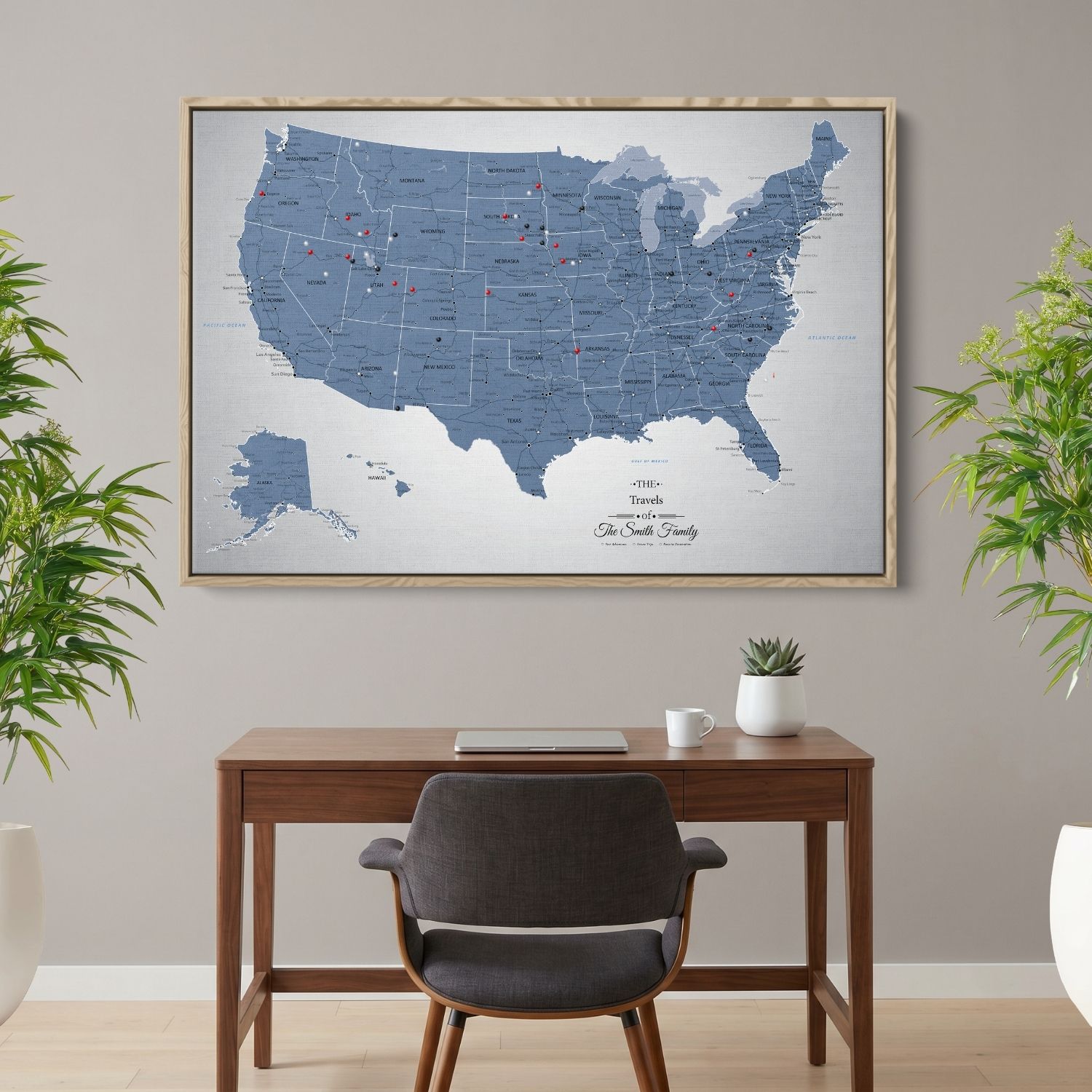 Personalized blue ice USA push pin travel map canvas in wood frame hanging above home office desk