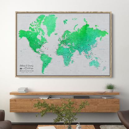 Enchanting Emerald watercolor world travel map canvas in wood frame hung above modern console