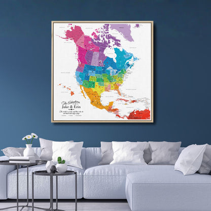 Colorful personalized North America travel map canvas with pins hung above modern living room sofa