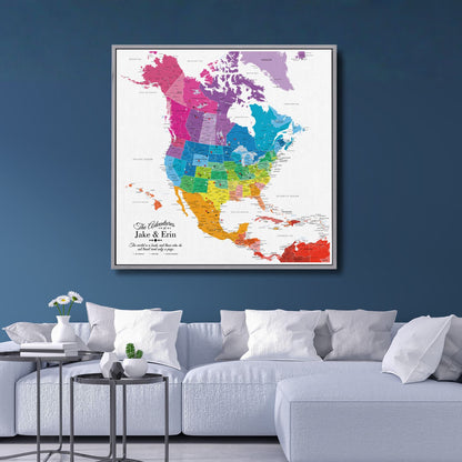 Colorful North America travel map canvas with pins hanging above modern white sofa