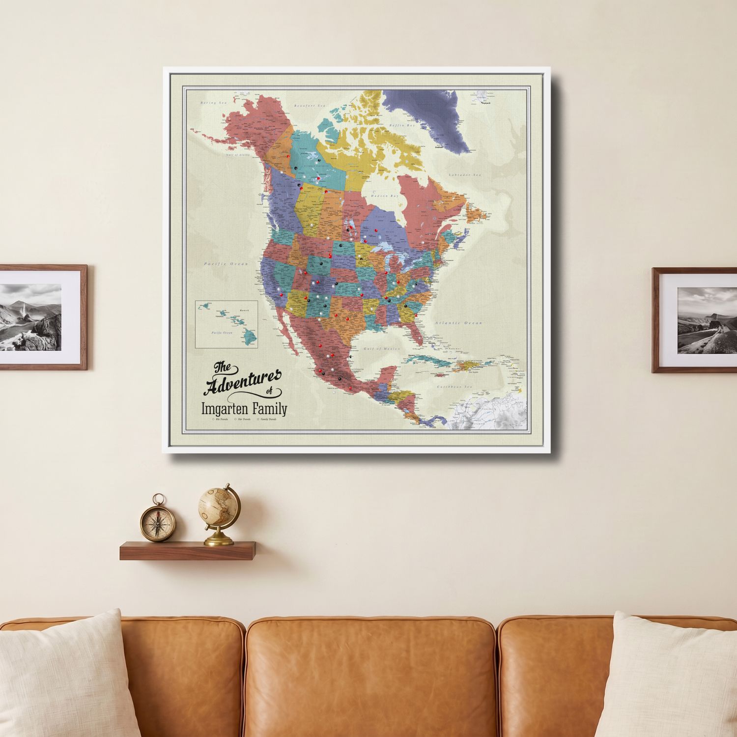 Personalized North America push pin travel map canvas hanging above leather sofa in living room