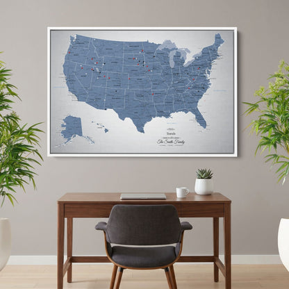 Personalized Blue Ice USA push pin travel map canvas hanging above home office desk with red and black pins marking visited states