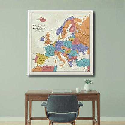 Personalized Europe push pin travel map canvas displayed above home office desk in white frame