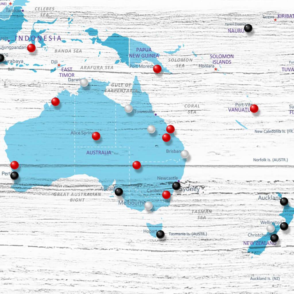 Closeup of Australia on Light Blue Anniversary World Travel Map with Pins